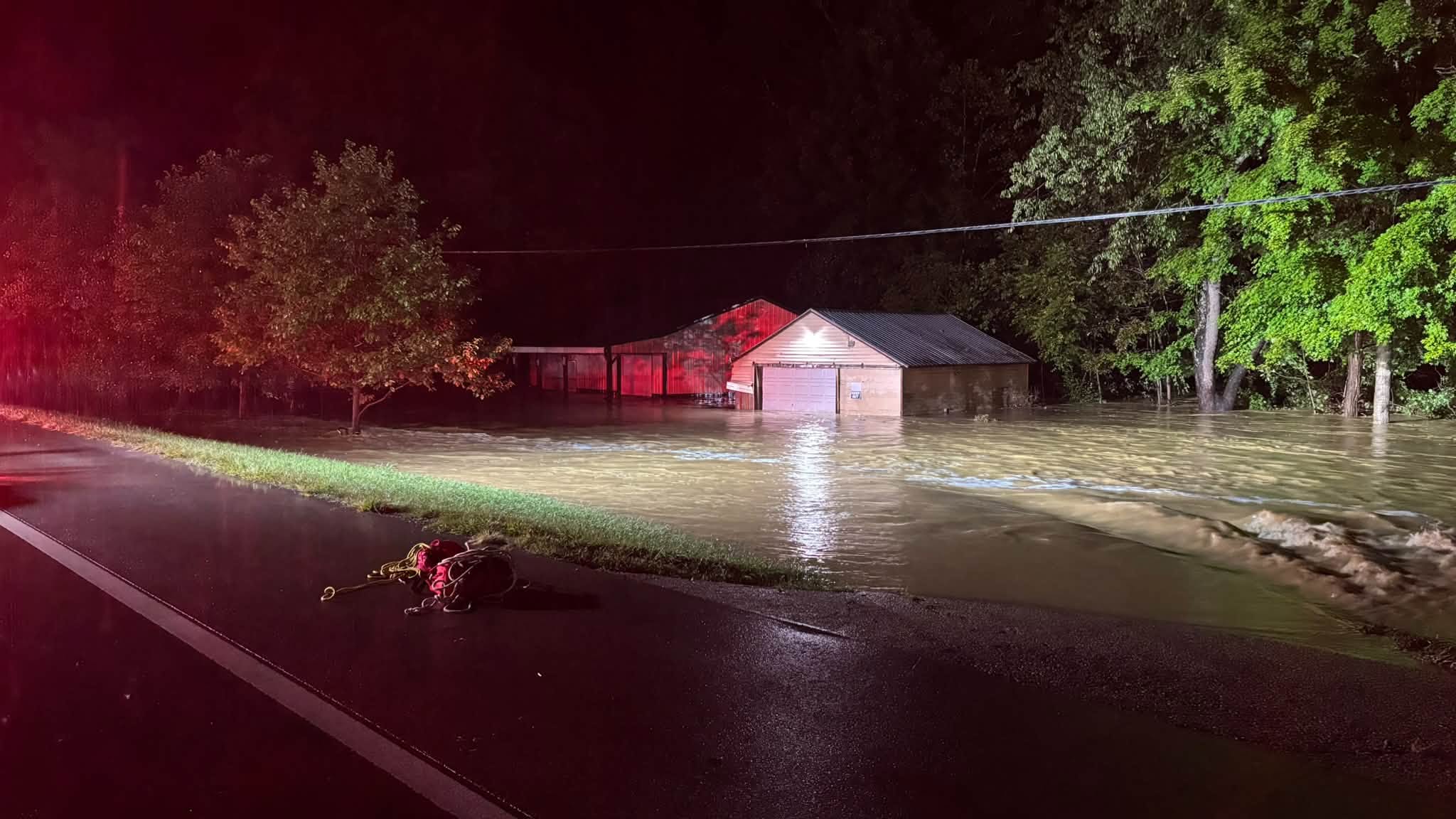 Crew rescues 2 as floodwaters sweep away Pike County home
